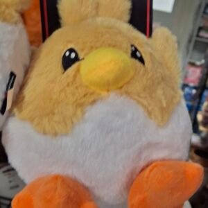 Peluche poussin jaune coquille